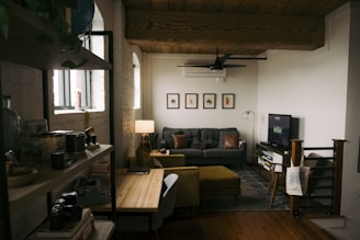 a living room filled with furniture and a flat screen tv