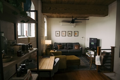 a living room filled with furniture and a flat screen tv
