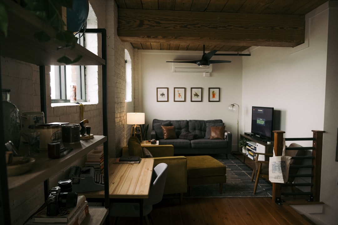 a living room filled with furniture and a flat screen tv,
