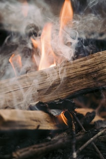 a close up of a fire with smoke coming out of it