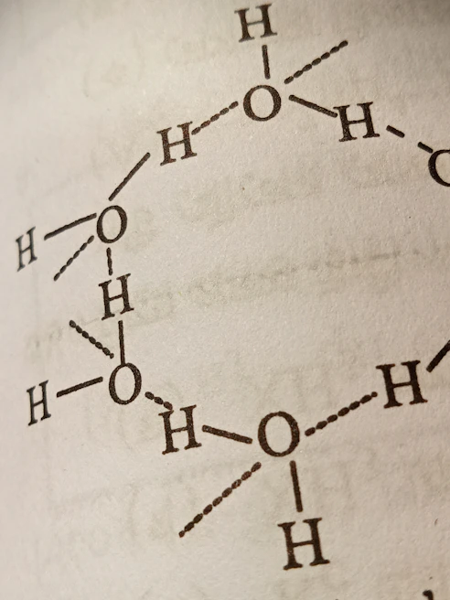 Close-up of a chemistry simulation illustrating molecular bonding with colorful atoms