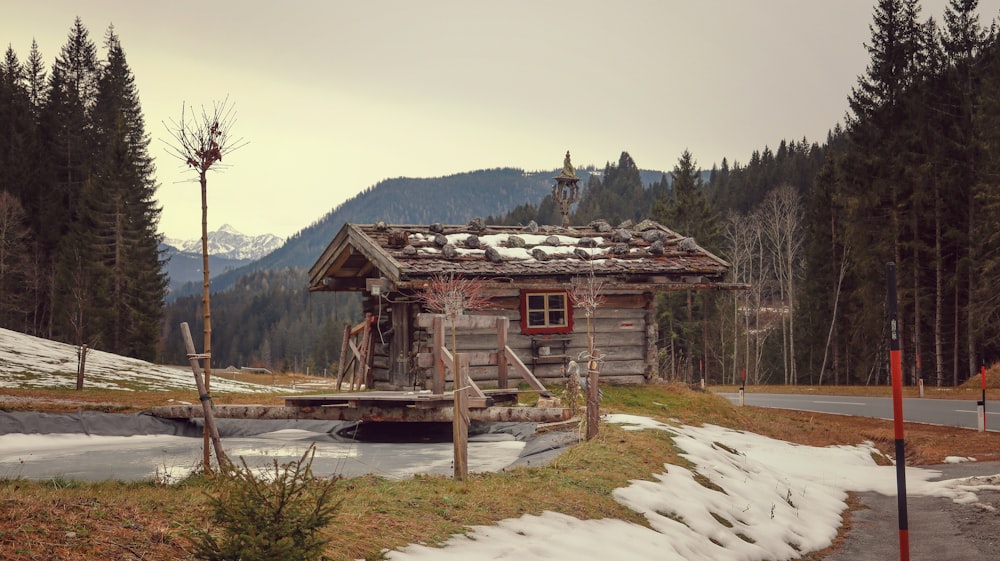 a log cabin in the middle of a snowy forest