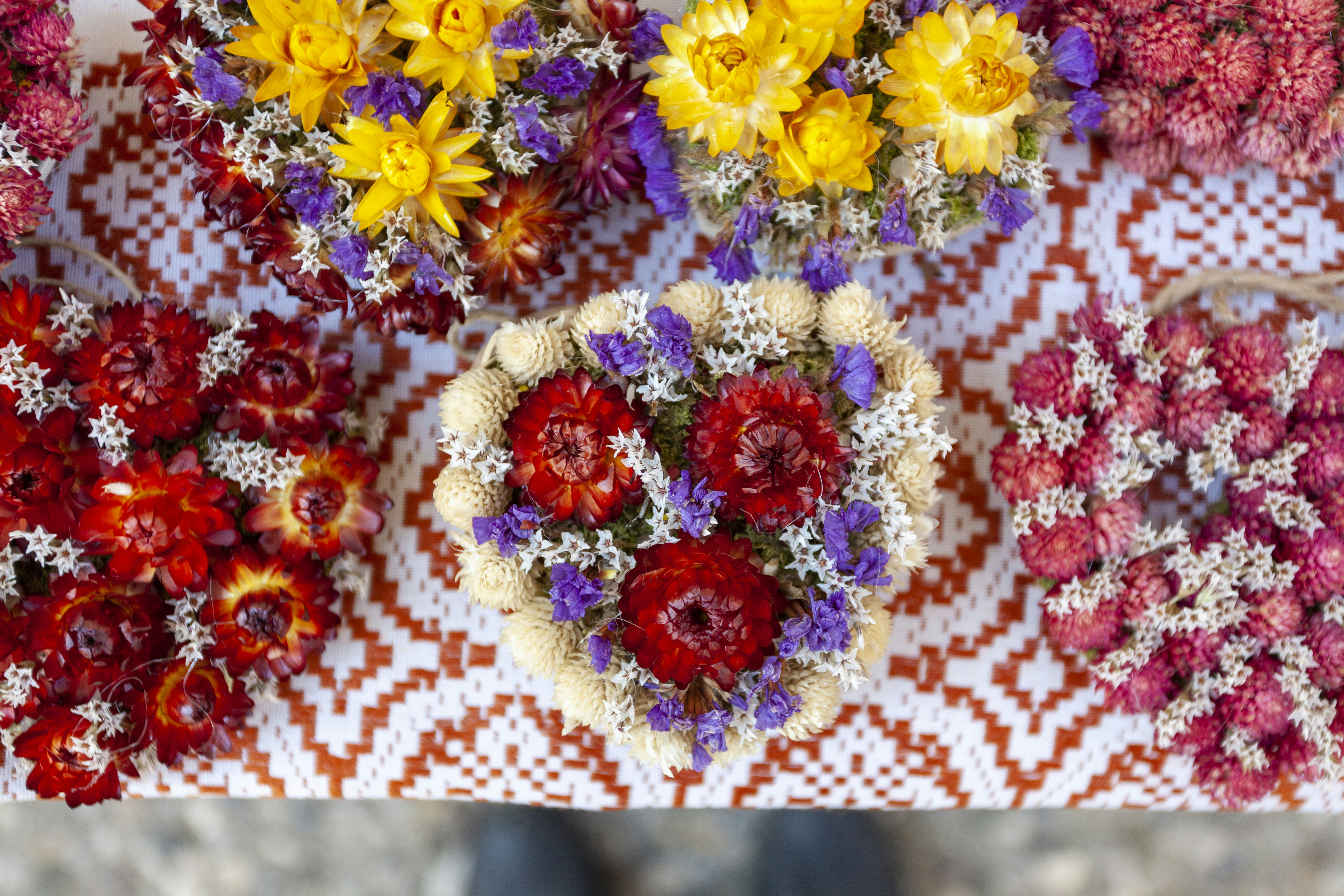 Rich saffron and turquoise cover with Indian textile patterns, vibrant and cultural