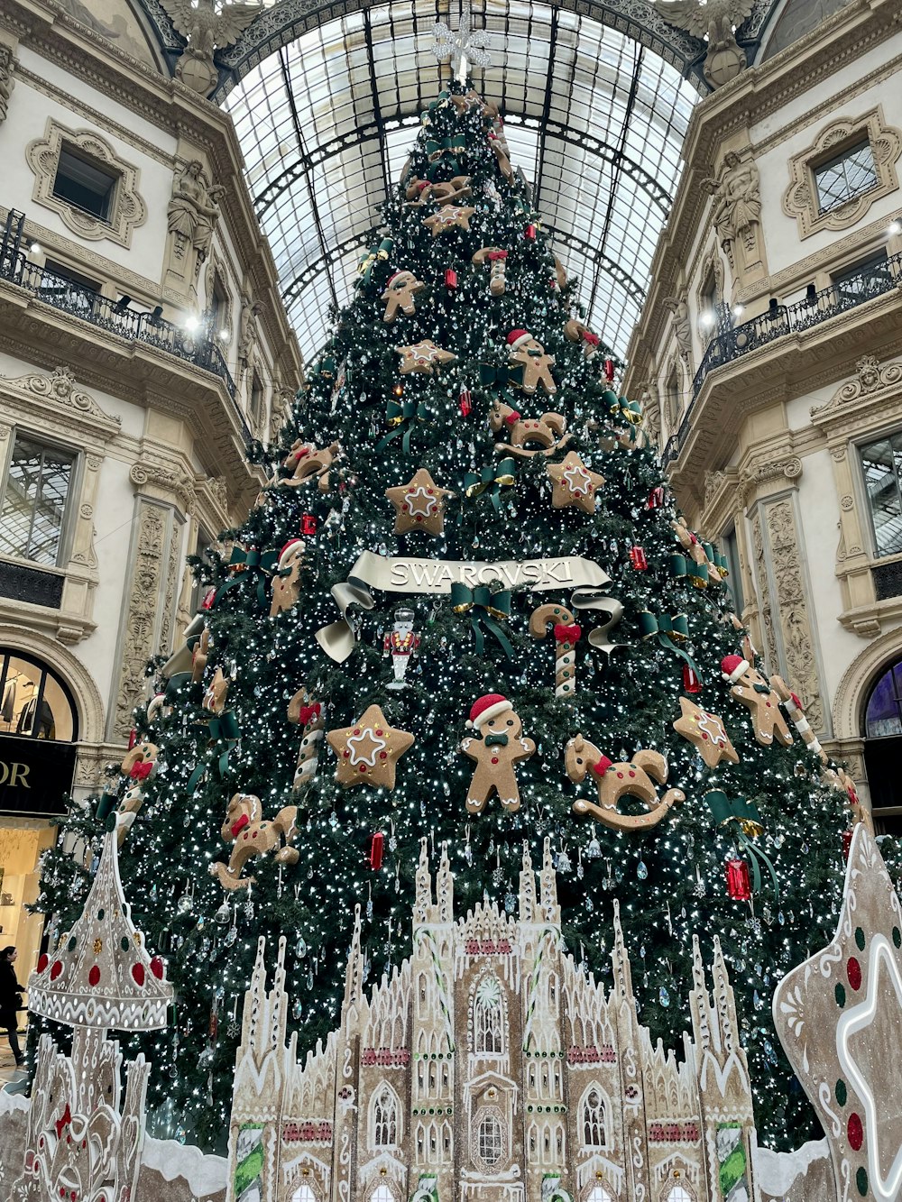 a large christmas tree in the middle of a mall