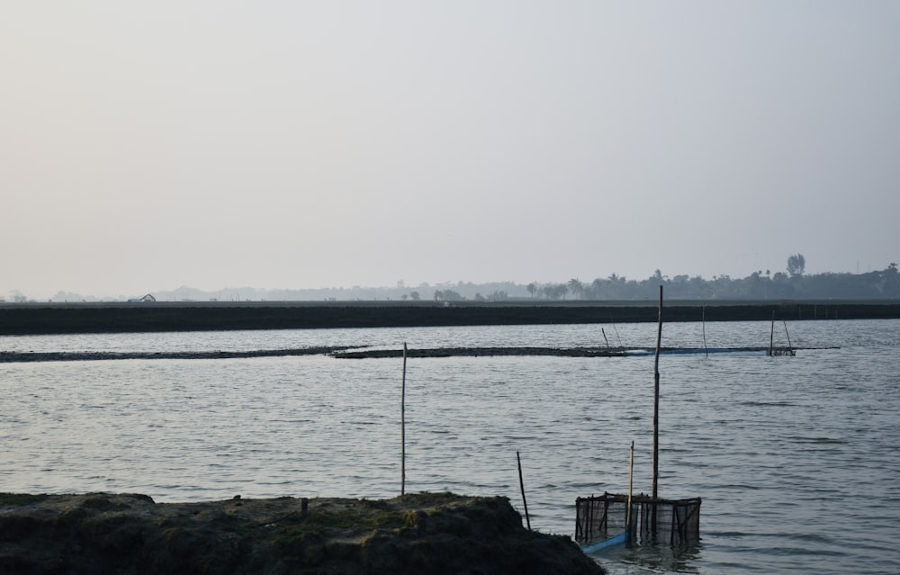 a body of water with a boat in the distance