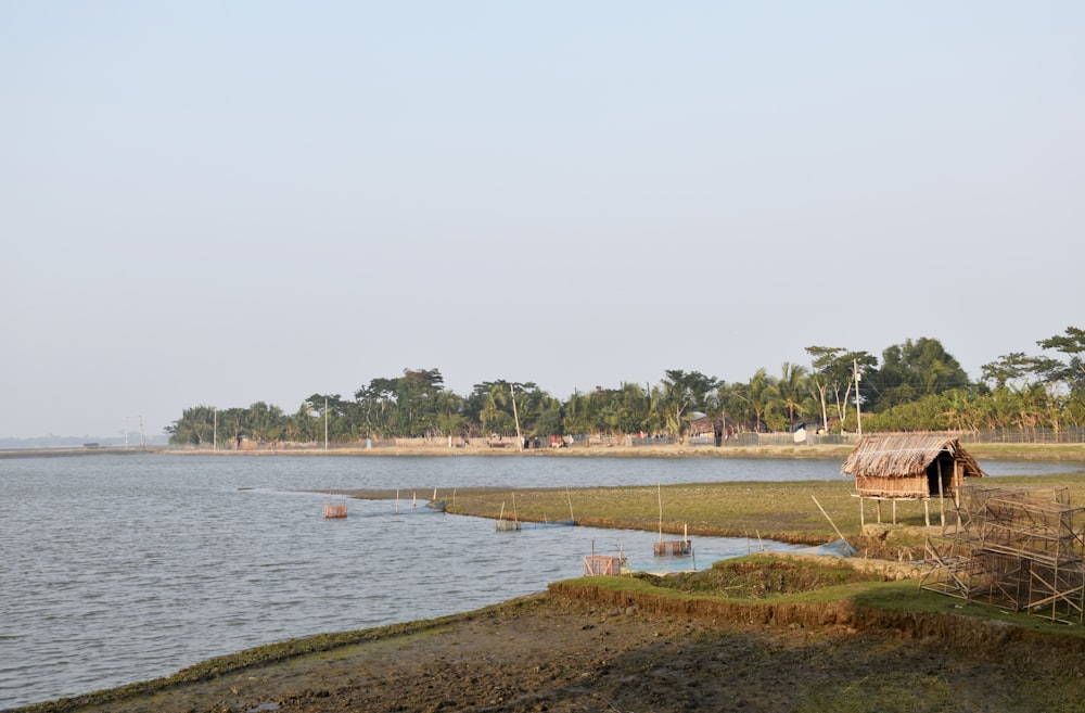 a body of water with a house on the shore