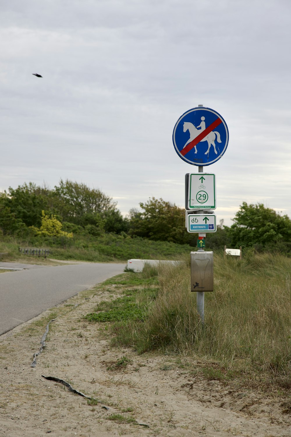 a street sign on the side of a road