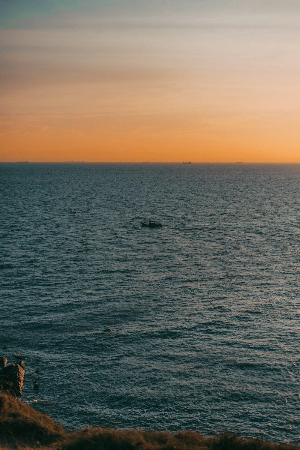 a body of water with a boat in the distance