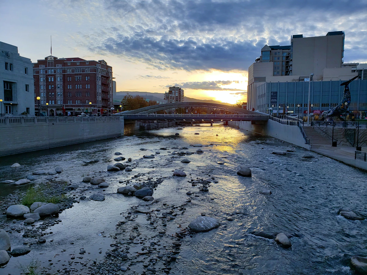 Downtown Reno, Nevada cityscape with the Truckee River and surrounding mountains