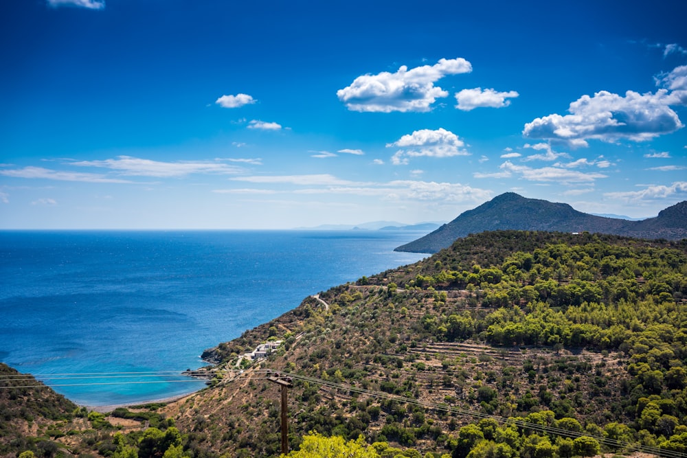 a scenic view of the ocean and mountains