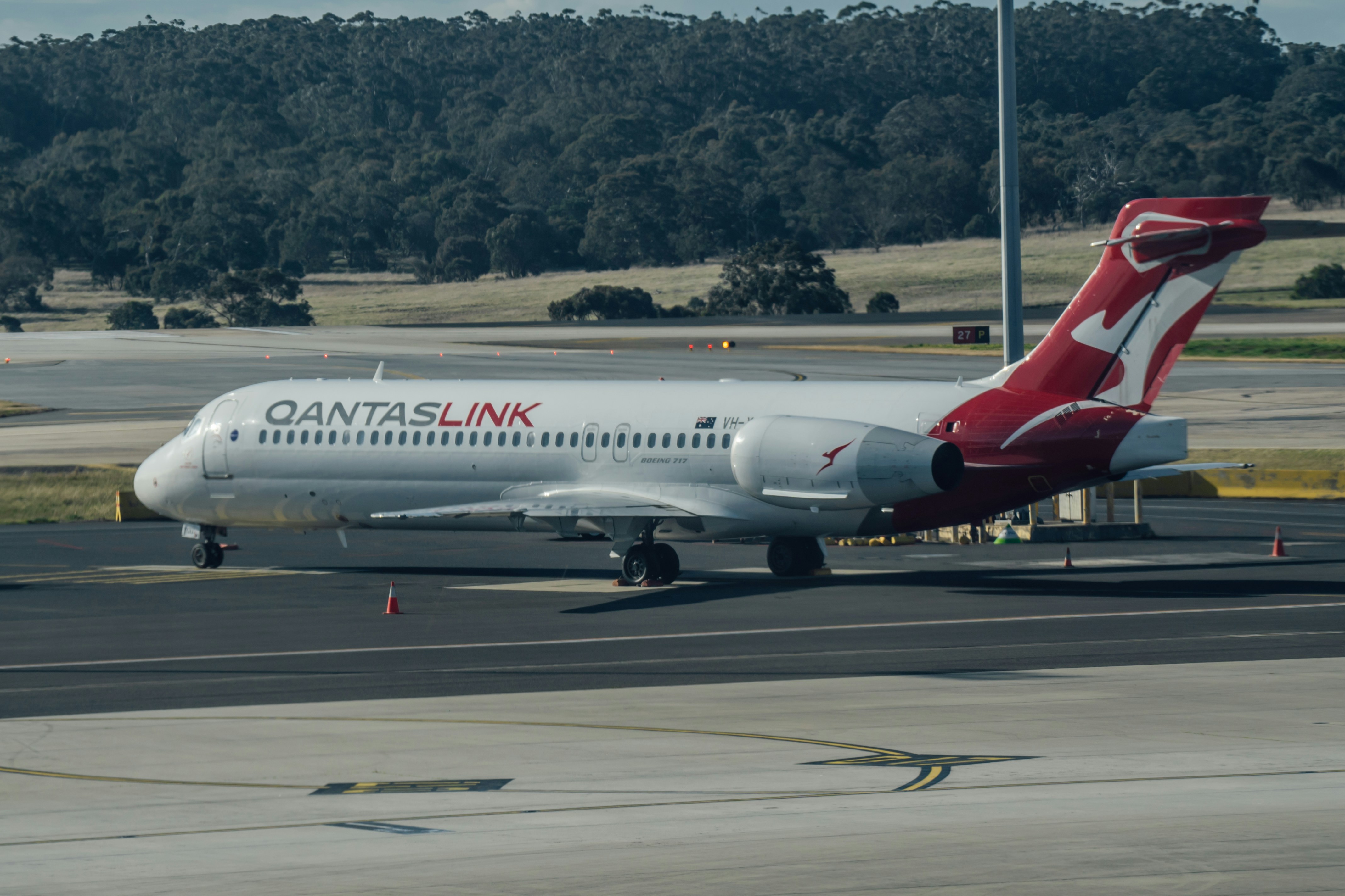 a large passenger jet sitting on top of an airport tarmac, 