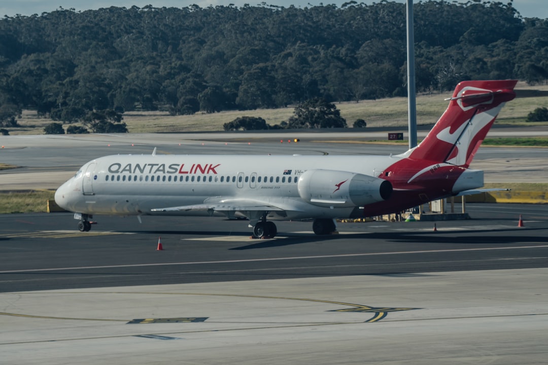 a large passenger jet sitting on top of an airport tarmac,