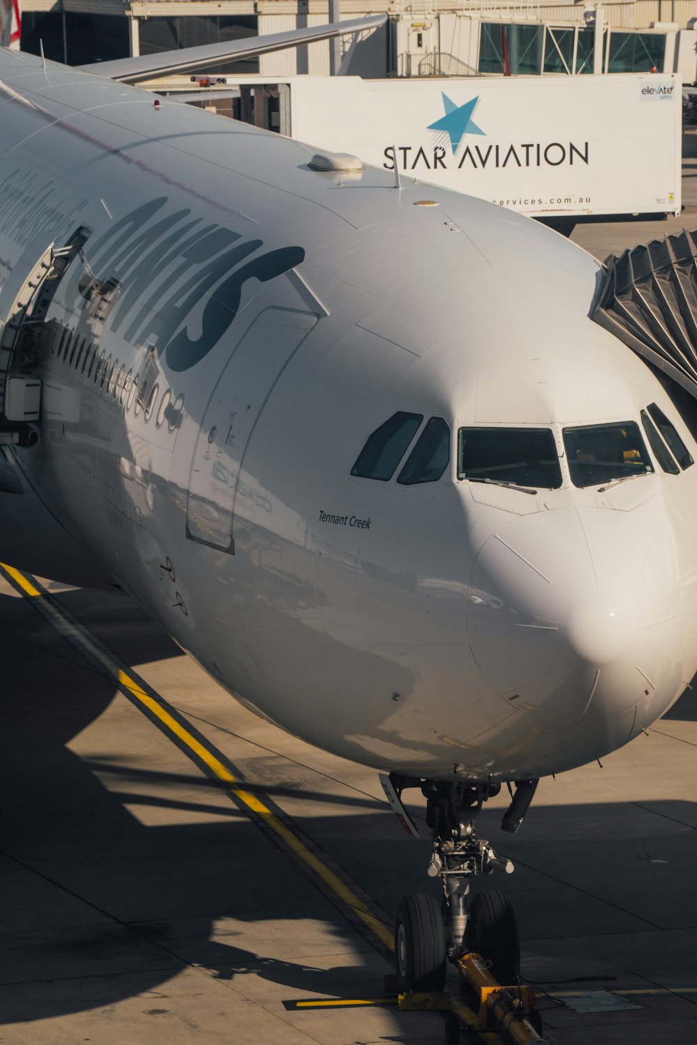 a large jetliner sitting on top of an airport tarmac