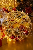A magical winter scene with golden lights and Christmas decorations.
