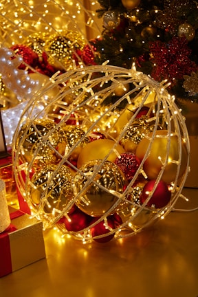 A magical winter scene with golden lights and Christmas decorations.