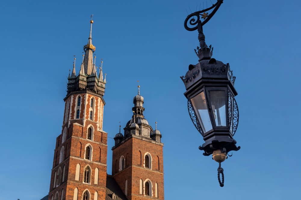 a street light and a building with two towers