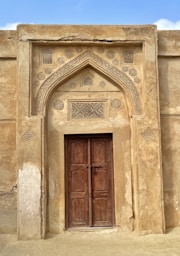 an old building with a large wooden door