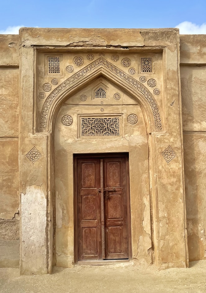 an old building with a large wooden door