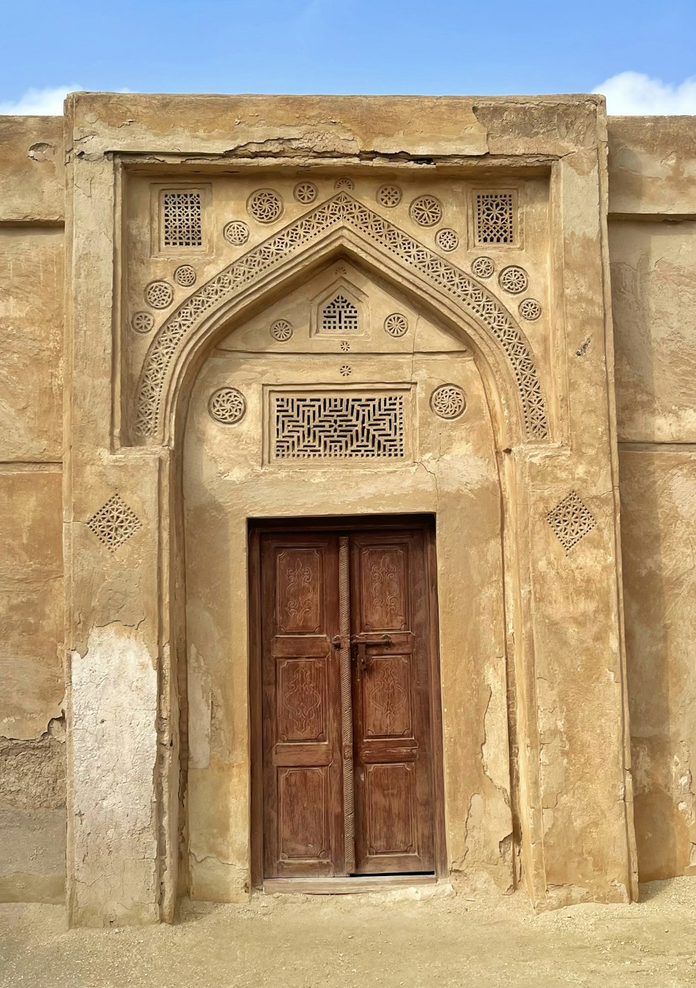 an old building with a large wooden door