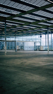 an empty parking garage with a lot of windows
