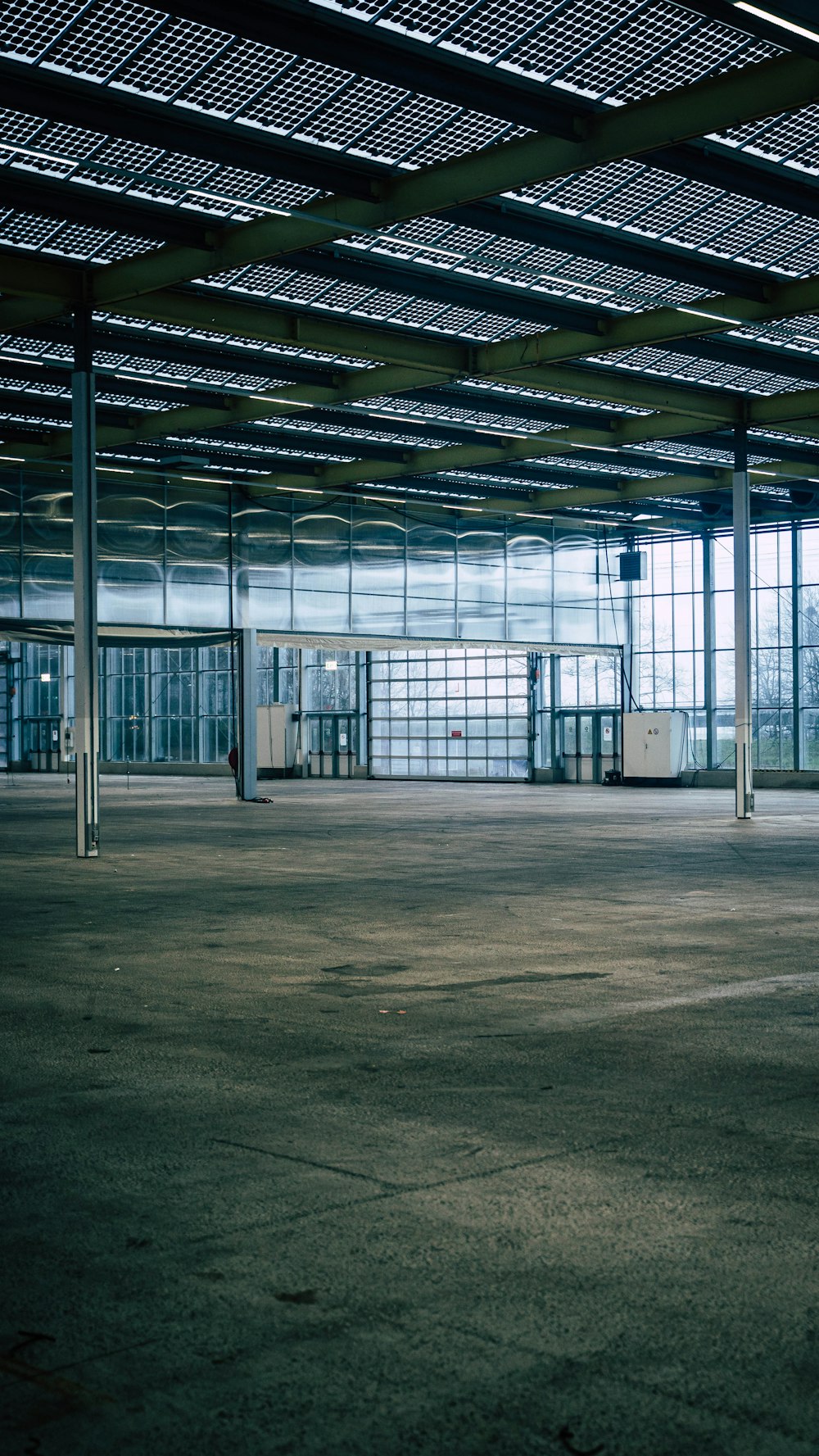an empty parking garage with a lot of windows