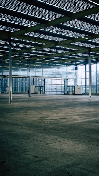 an empty parking garage with a lot of windows