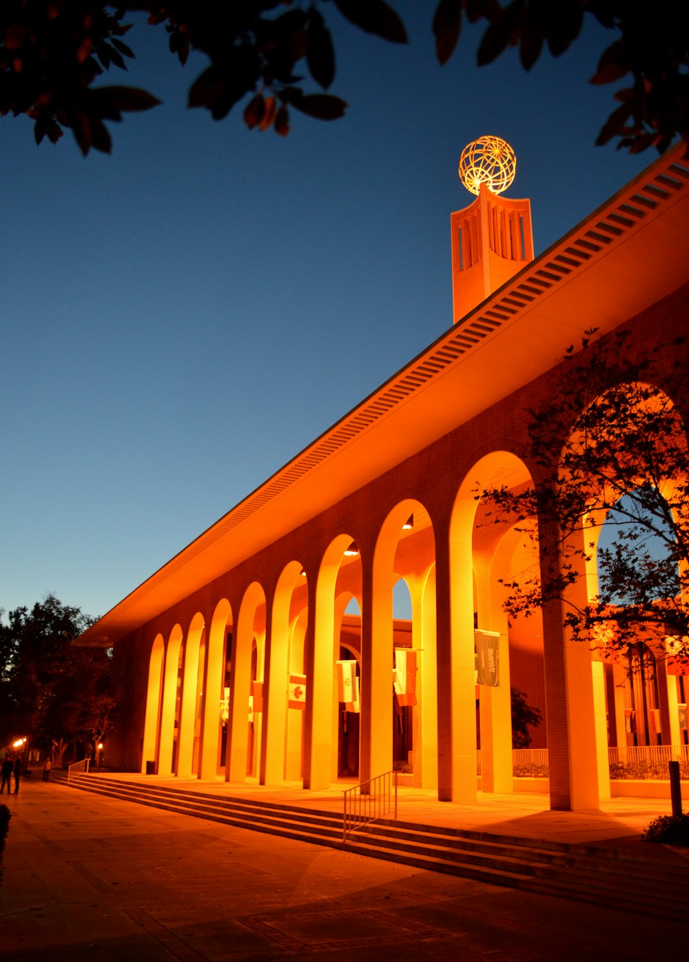 a building with a clock tower lit up at night