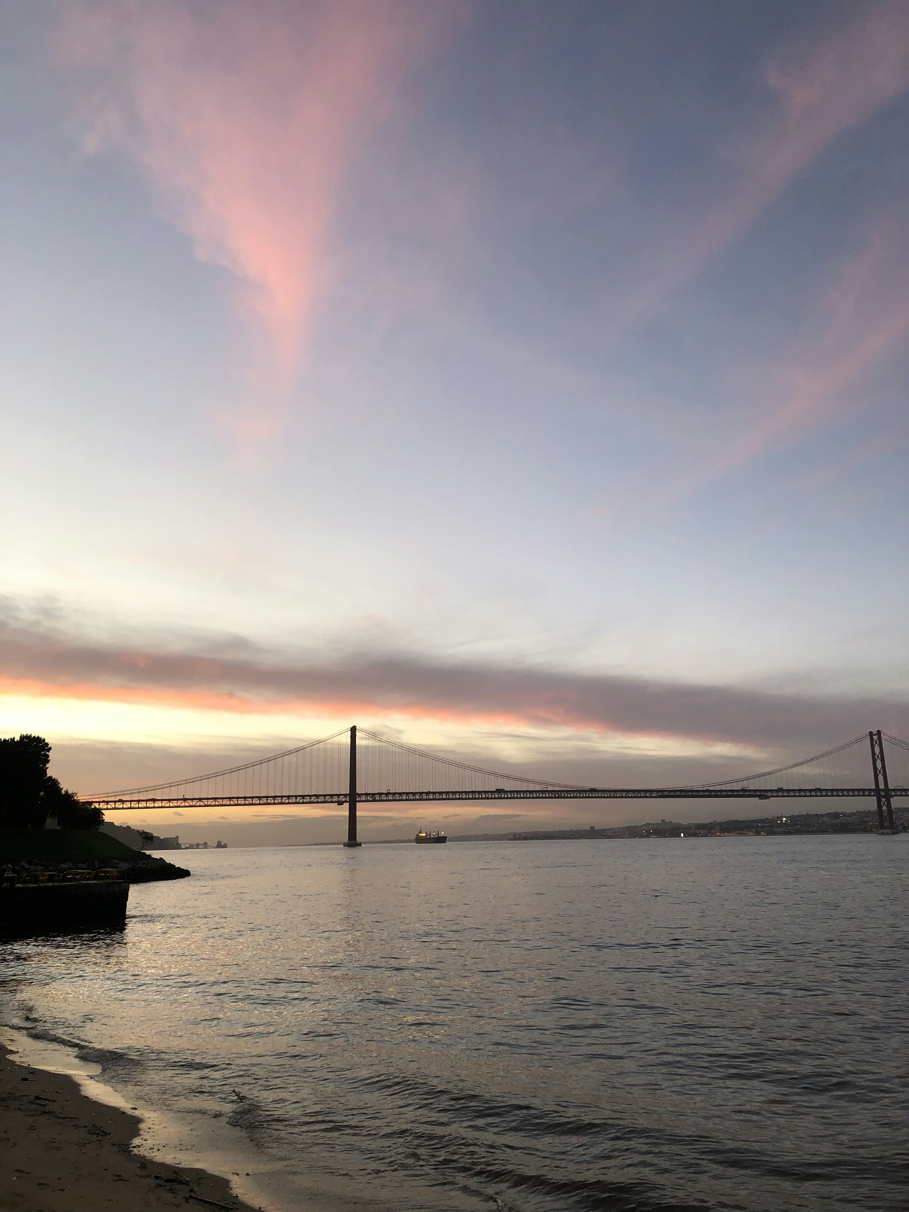 a large bridge spanning over a large body of water
