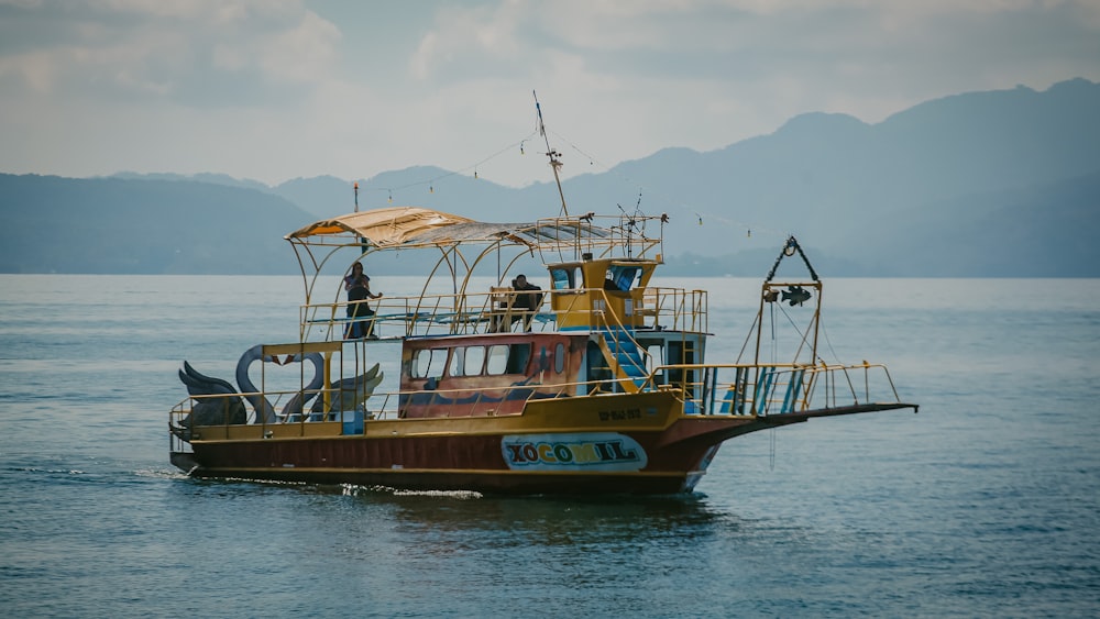 a boat with people on it in the water