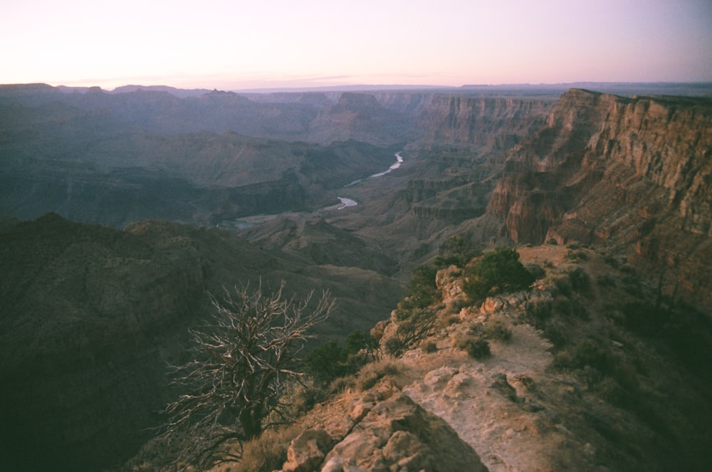 a view of a canyon with a river running through it