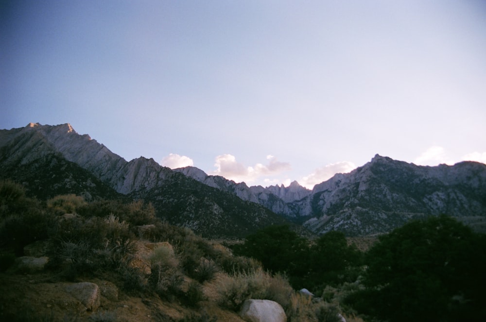 a view of a mountain range from a trail