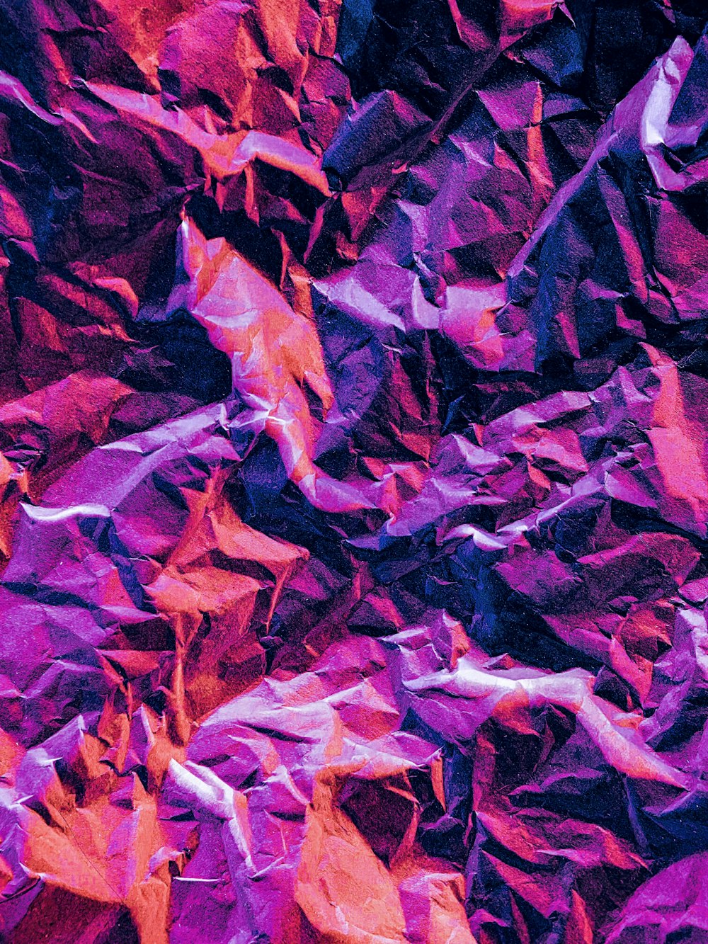 a close up of a purple and red background