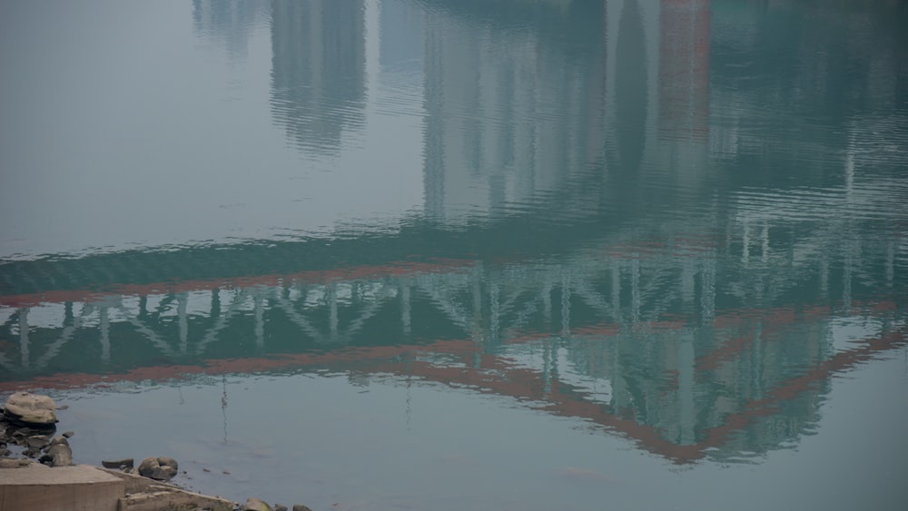 a large body of water with a bridge in the middle of it