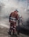 Two construction workers wearing reflective orange suits and white helmets are working on a road at night. One is holding a shovel while the other is engaged in raking or smoothing the asphalt. The scene is enveloped in a cloud of dust and smoke from the construction work.