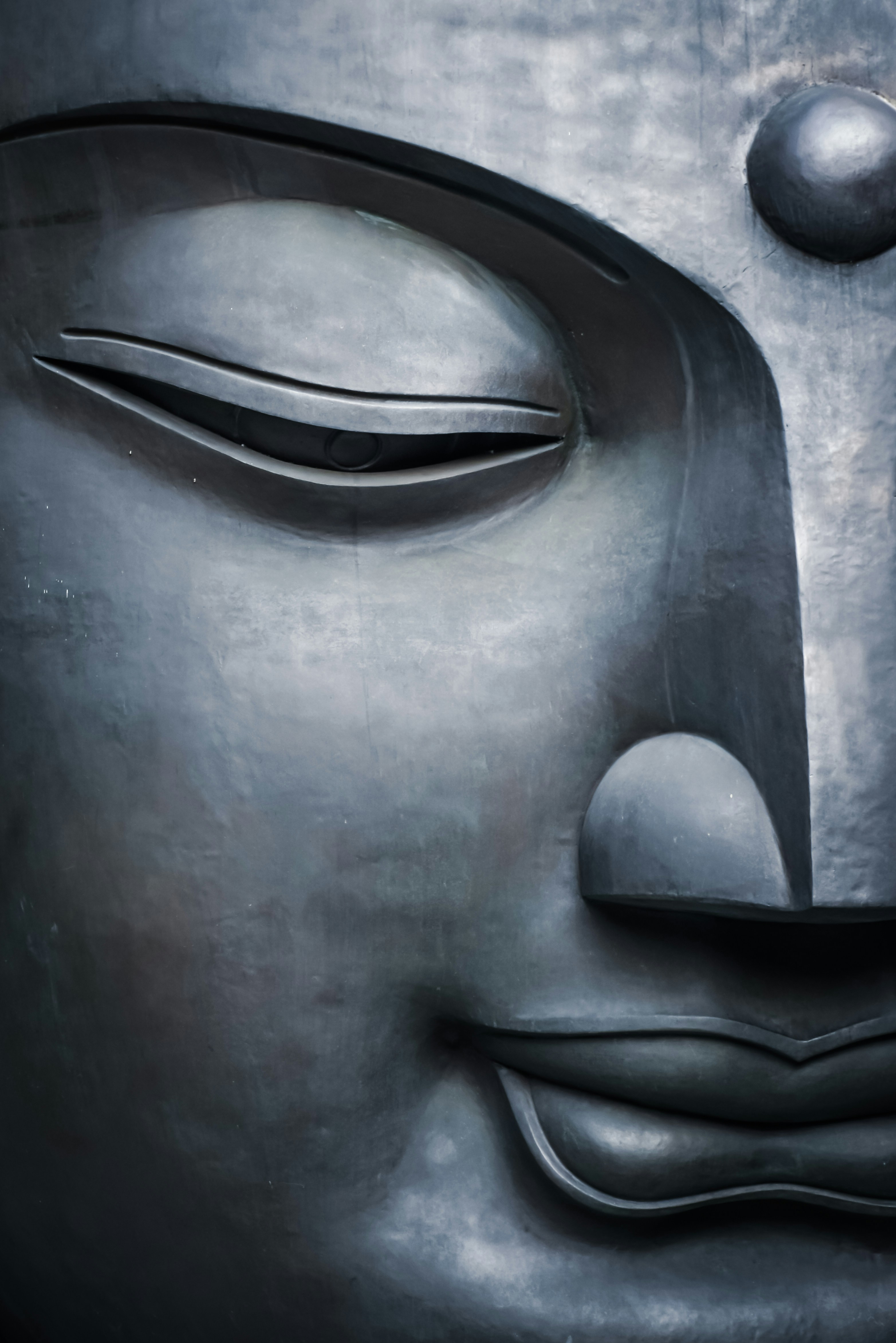 A close-up of a statue of a person's face