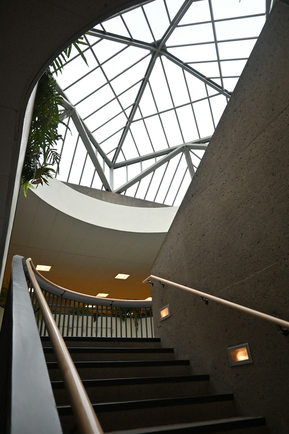 a view of a staircase with a skylight above it