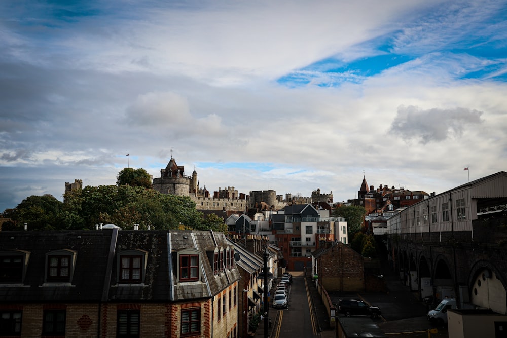 a view of a city with a castle in the background