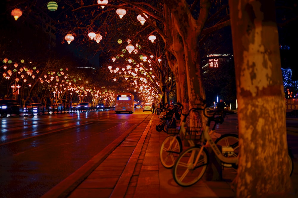 a couple of bikes parked next to a tree