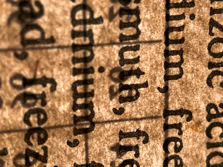 Close-up of technical documents with precise terminology highlighted.