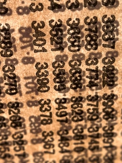 A close-up of a lottery ticket with numbers clearly visible under soft natural light.