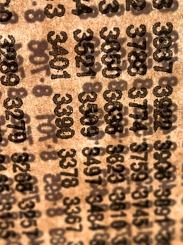 A close-up of a lottery ticket with numbers clearly visible under soft natural light.