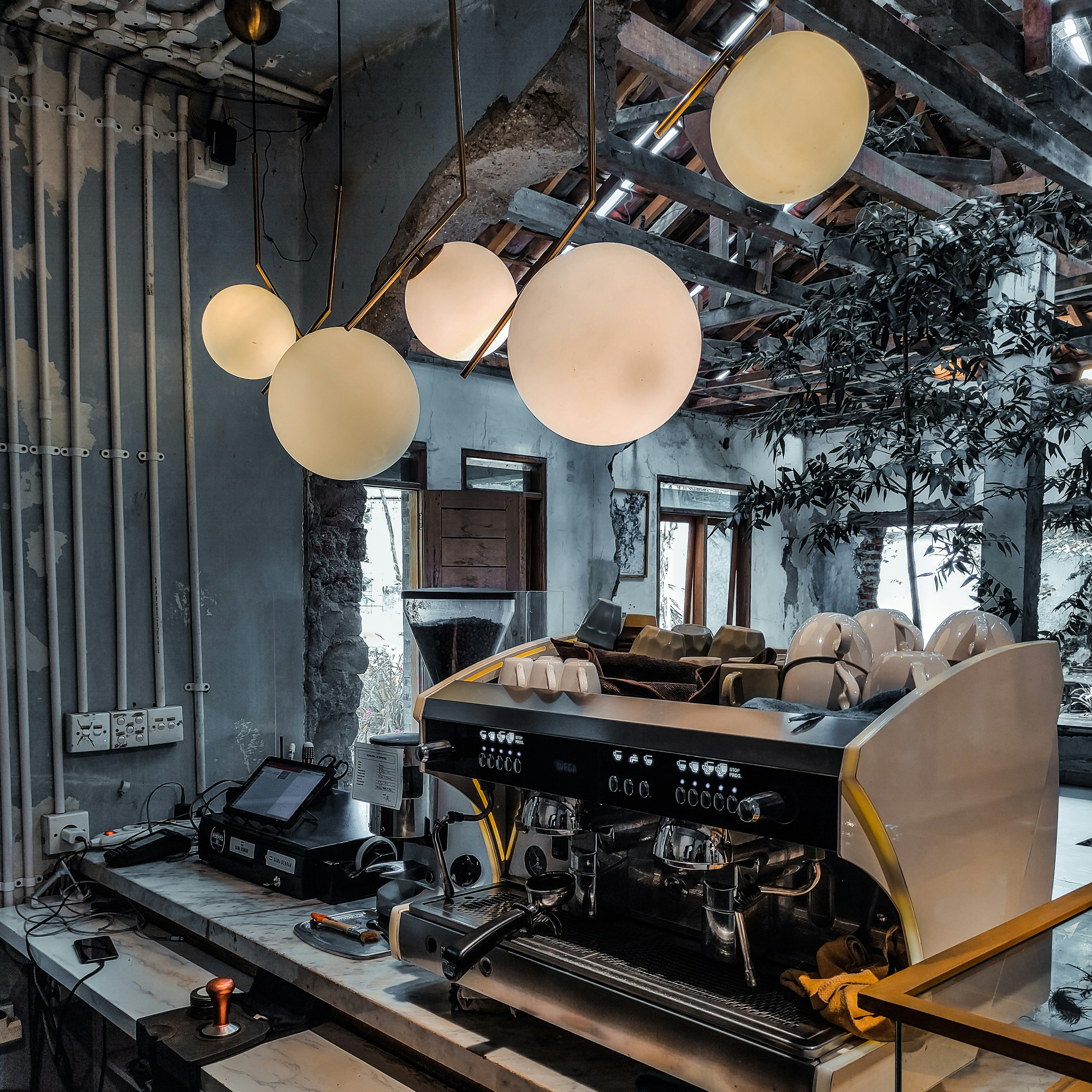 a room that has a bunch of lights hanging from the ceiling