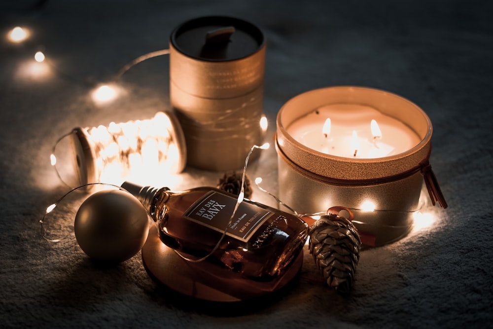 a candle and some christmas decorations on a table