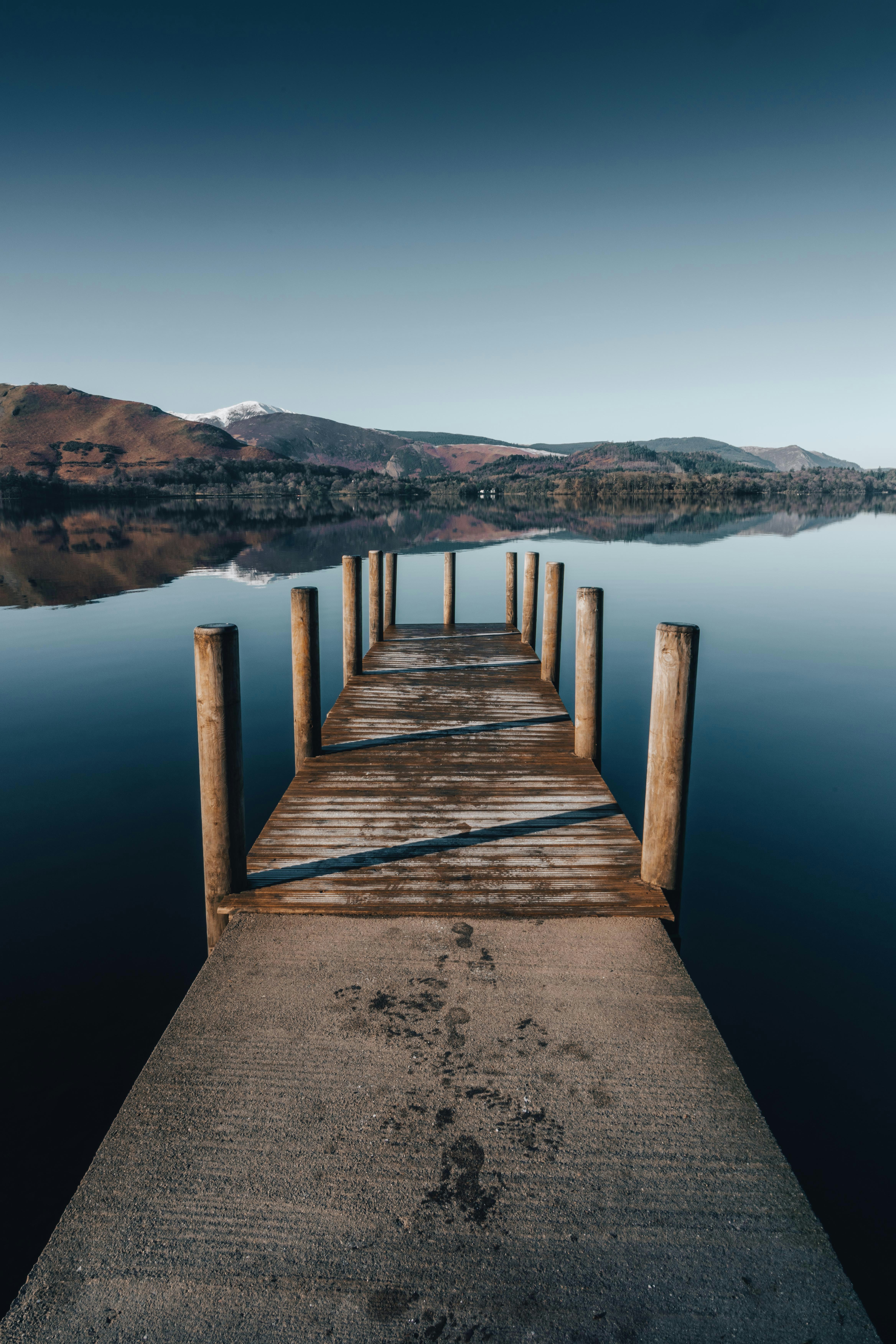 a wooden dock sitting on top of a body of water