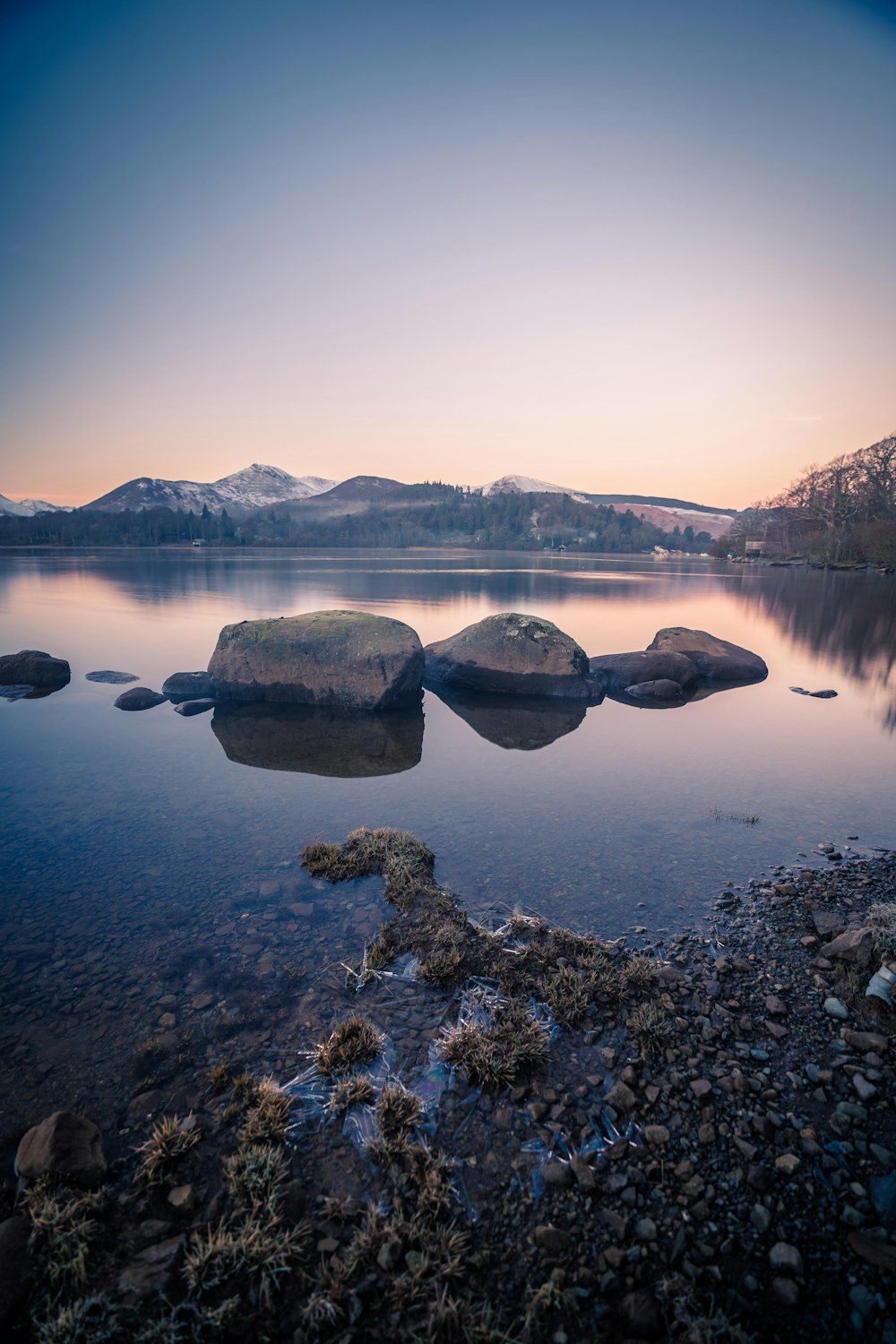 a body of water with some rocks in it