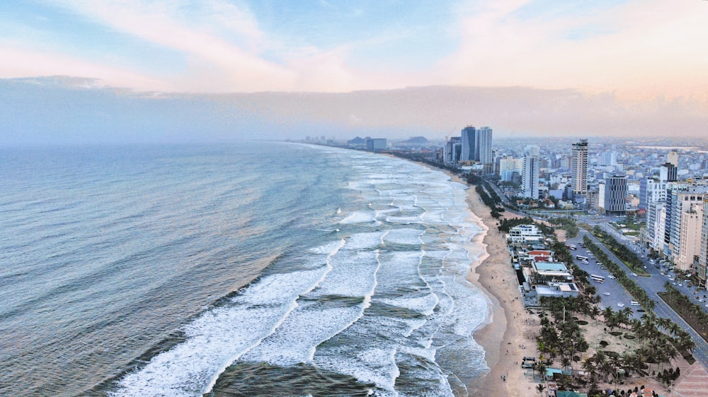 an aerial view of a beach and a city