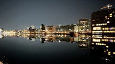 a view of a city at night from across a body of water