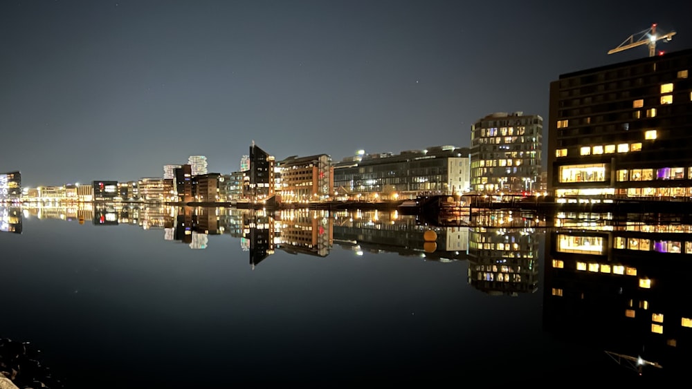 a view of a city at night from across a body of water