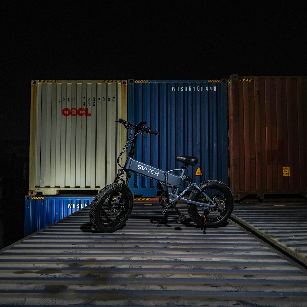 a bike is parked on the side of a train track