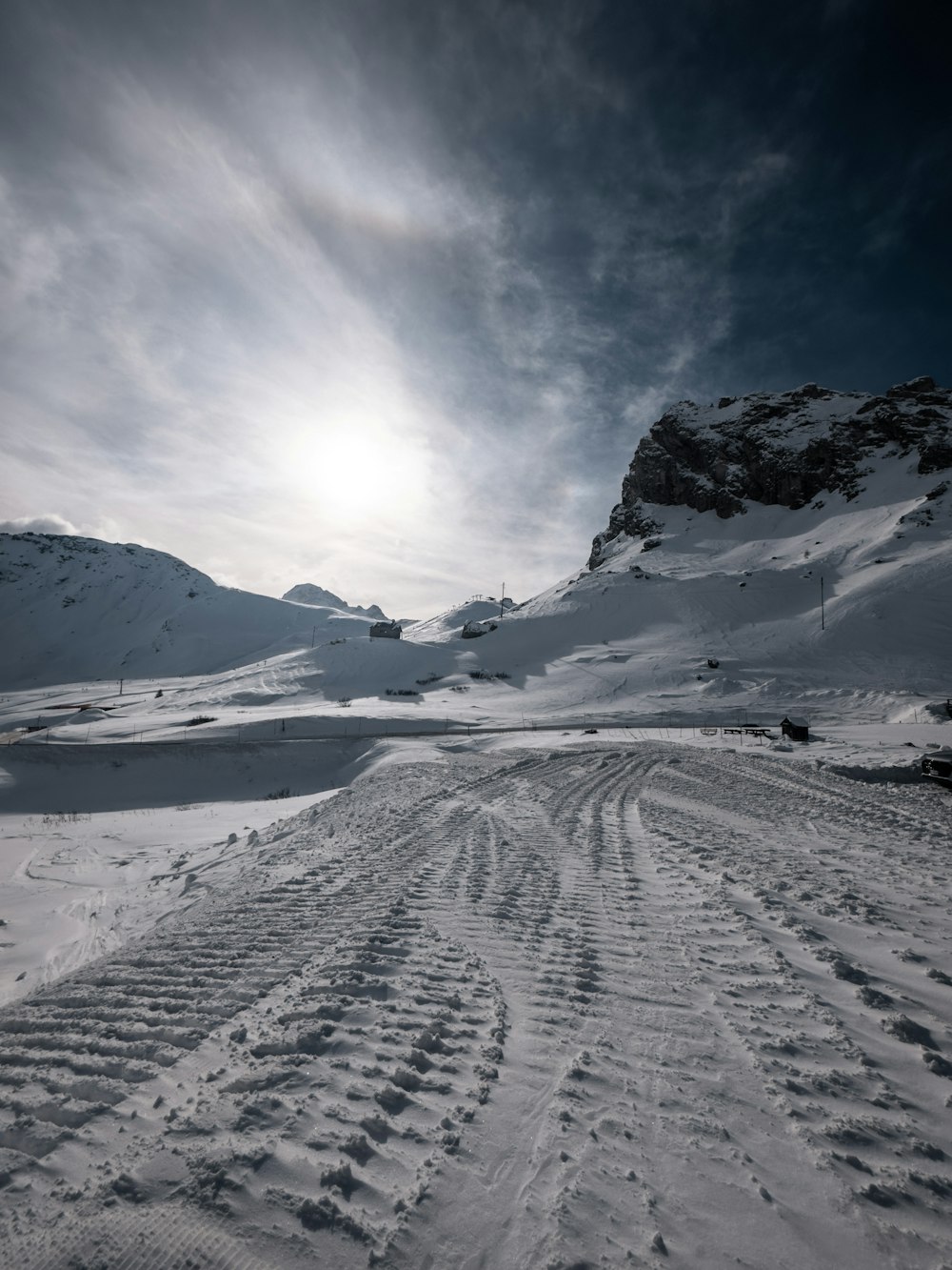 a person riding skis down a snow covered slope